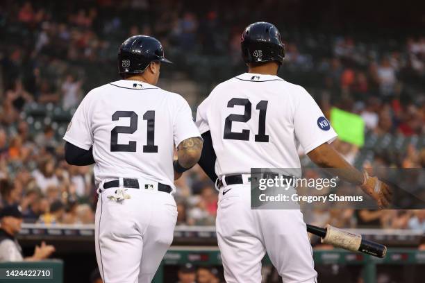 Javier Baez of the Detroit Tigers celebrates with Jeimer Candelario on deck after scoring in the first inning against the Chicago White Sox at...