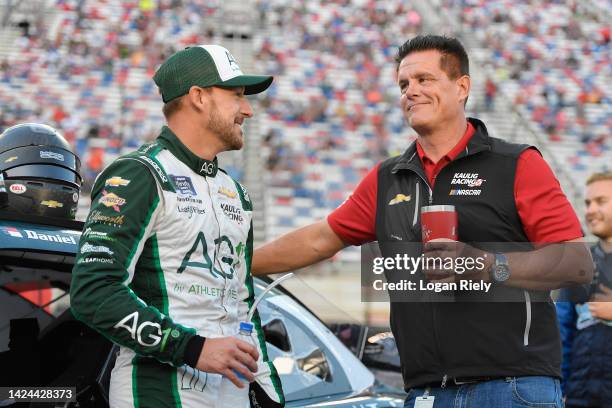 Landon Cassill, driver of the Voyager: Crypto for All Chevrolet, and Matt Kaulig, owner of Kaulig Racing talk on the grid prior to the NASCAR Xfinity...