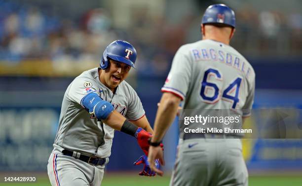 Nathaniel Lowe of the Texas Rangers is congratulated after hitting a two run home run in the third inning during a game against the Texas Rangers at...