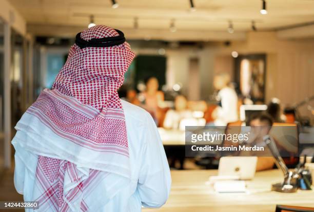 arabic businessman in office, rear view - kaffiyeh stock pictures, royalty-free photos & images