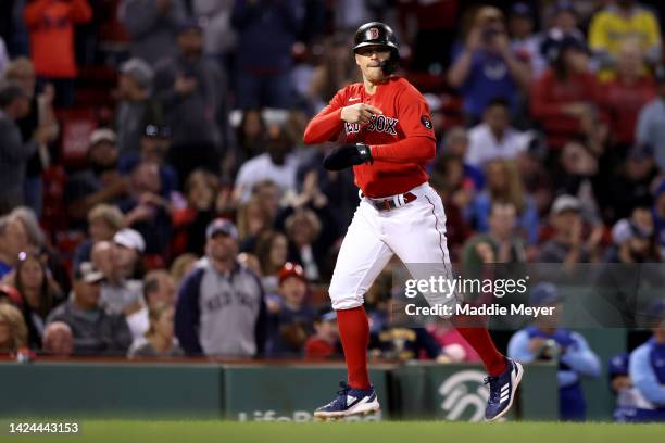 Enrique Hernandez of the Boston Red Sox celebrates as he scores a run against the Kansas City Royals during the eighth inning at Fenway Park on...