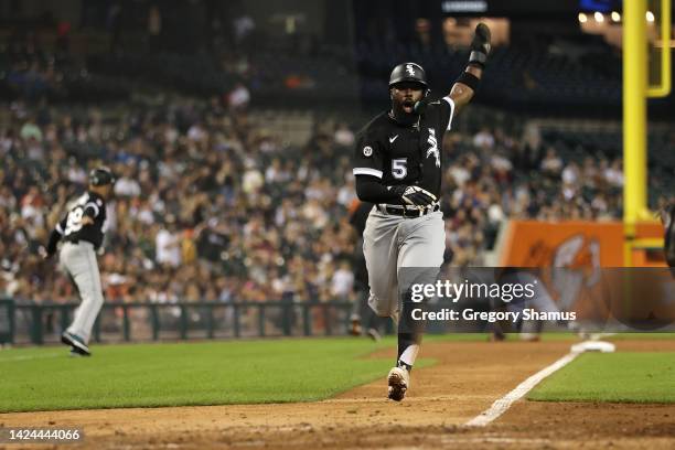 Josh Harrison of the Chicago White Sox celebrates scoring a run in the eighth inning while playing the Detroit Tigers at Comerica Park on September...