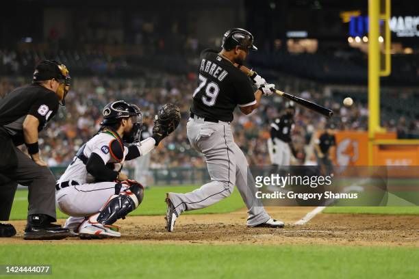Jose Abreu of the Chicago White Sox hits a two run double in the eighth inning in front of Eric Haase of the Detroit Tigers at Comerica Park on...