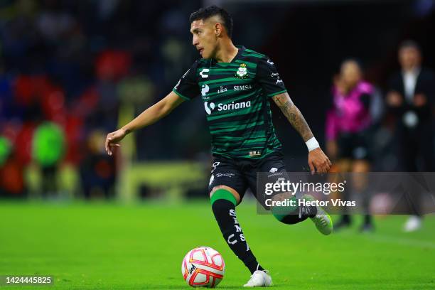 Leonardo Suarez of Santos Laguna runs with the ball during the 5th round match between America and Santos Laguna as part of the Torneo Apertura 2022...