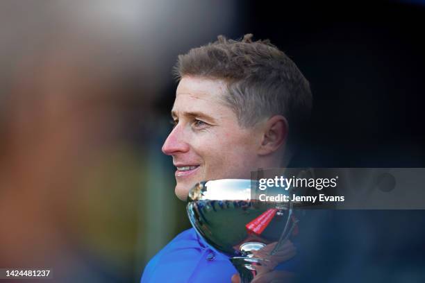 James McDonald holds his trophy after winning race 7 the Fujitsu General George Main Stakes on Anamoe during Sydney Racing at Royal Randwick...