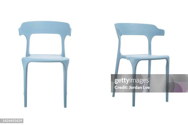 turquoise colored plastic chair with white background - plastic design furniture stock pictures, royalty-free photos & images