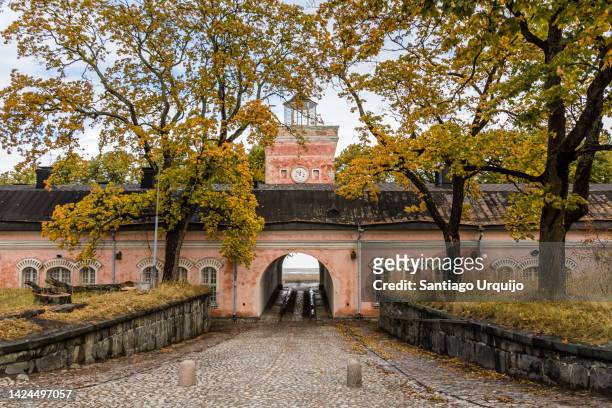 old buildings by the sea in suomenlinna - suomenlinna stock pictures, royalty-free photos & images