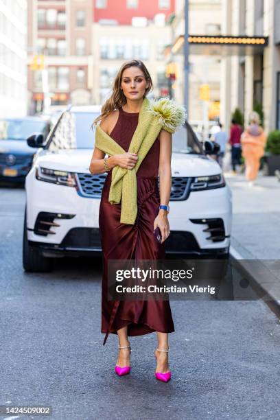 Olivia Palermo wearing silk skirt, top, pink heels outside on September 14, 2022 in New York City.