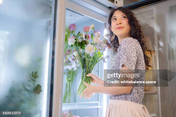 owner opening store in the morning. - florist arranging stock pictures, royalty-free photos & images