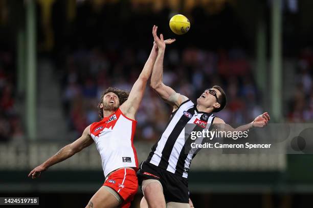 Tom Hickey of the Swans and Mason Cox of the Magpies contest the ball during the AFL Second Preliminary match between the Sydney Swans and the...