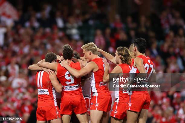 Logan McDonald of the Swans celebrates kicking a goal with team mates during the AFL Second Preliminary match between the Sydney Swans and the...