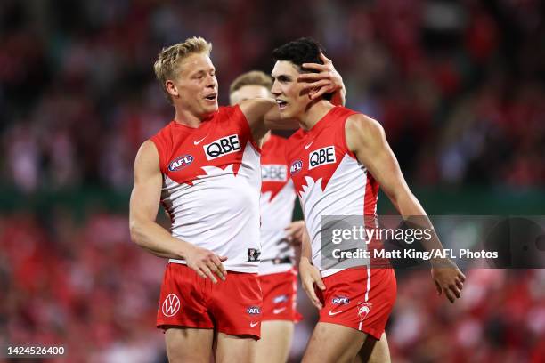 Justin McInerney of the Swans celebrates with Isaac Heeney after kicking a goal during the AFL Second Preliminary match between the Sydney Swans and...