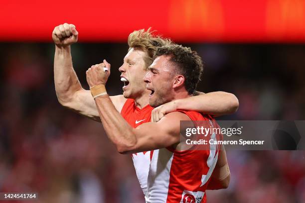 Will Hayward of the Swans and Callum Mills of the Swans celebrate winning the AFL Second Preliminary match between the Sydney Swans and the...