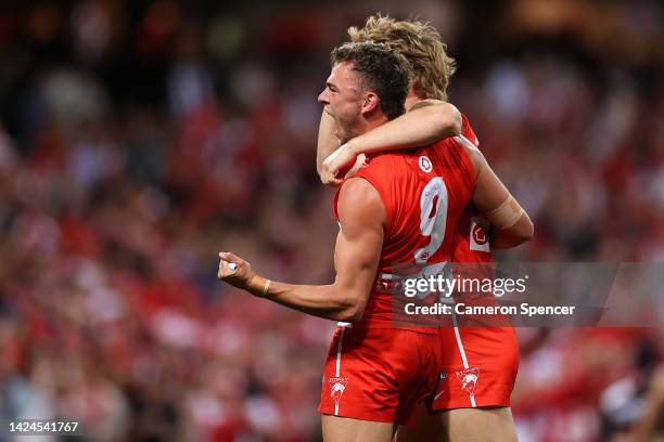 Will Hayward of the Swans and Callum Mills of the Swans celebrate winning the AFL Second Preliminary match between the Sydney Swans and the...