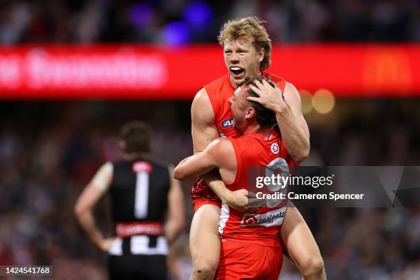 Will Hayward of the Swans and Callum Mills of the Swans celebrate winning the AFL Second Preliminary match between the Sydney Swans and the...