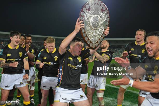 Jackson Garden-Bachop of Wellington celebrates with the Ranfurly Shield following the round seven Bunnings NPC match between Hawke's Bay and...