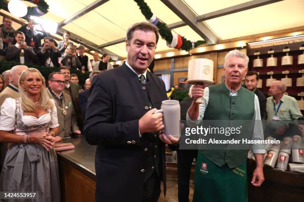 Bavarian Minister-President Markus Söder clinks the first beer mugs with Munich’s Lord Mayor Dieter Reiter at Schottenhamel beer tent on the opening...