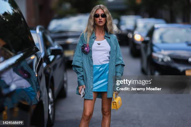 Emili Sindlev is seen wearing black shades, white Prada top, green striped shirt, blue leather short skirt, yellow leather mini bag, outside Jonathan...