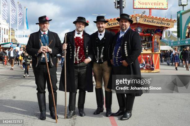 Fancy dressed people pose for a photo prior to the Einzug der Wiesenwirte of the 2022 Oktoberfest beer fest on September 17, 2022 in Munich, Germany....