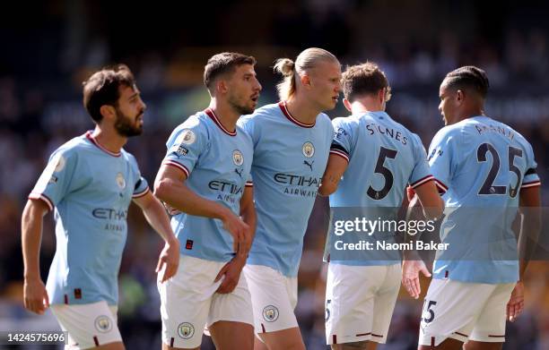 Bernardo Silva, Ruben Dias, Erling Haaland, John Stones and Manuel Akanji of Manchester City form a wall during the Premier League match between...