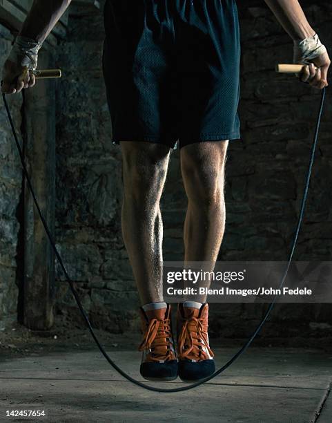 caucasian boxer training and jumping rope - john hale stock pictures, royalty-free photos & images