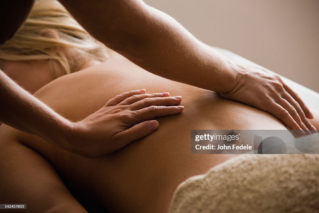 Caucasian woman receiving massage