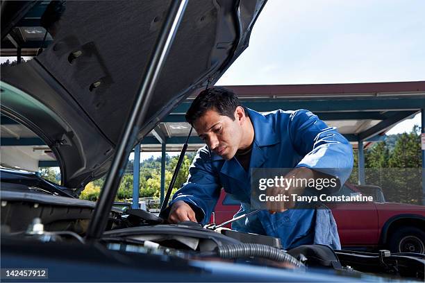 middle eastern mechanic working on car engine - memorial service of constantine mitsotakis stockfoto's en -beelden
