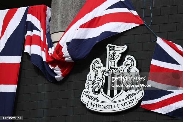 Union Jack flags are seen outside the stadium to pay tribute to Her Majesty Queen Elizabeth II who died at Balmoral Castle on September 8 prior to...