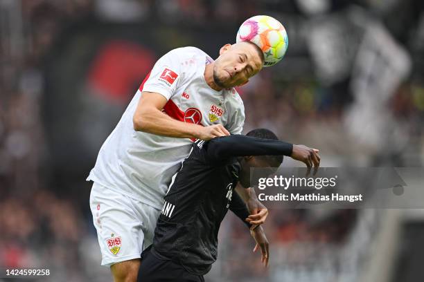 Waldemar Anton of VfB Stuttgart battles for possession with Randal Kolo Muani of Eintracht Frankfurt during the Bundesliga match between VfB...