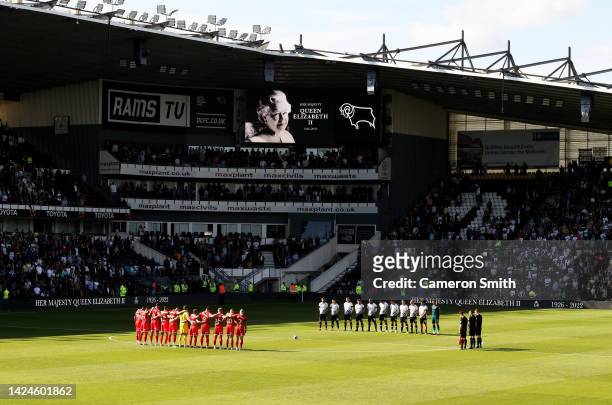 Players, officials and fans take part in a minute’s silence as a tribute to Her Majesty Queen Elizabeth II who died at Balmoral Castle on September 8...