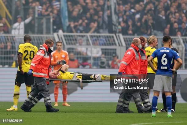 Marco Reus of Borussia Dortmund is stretched off after receiving medical treatment during the Bundesliga match between Borussia Dortmund and FC...