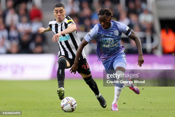 Jordan Zemura of AFC Bournemouth is challenged by Miguel Almiron of Newcastle United during the Premier League match between Newcastle United and AFC...