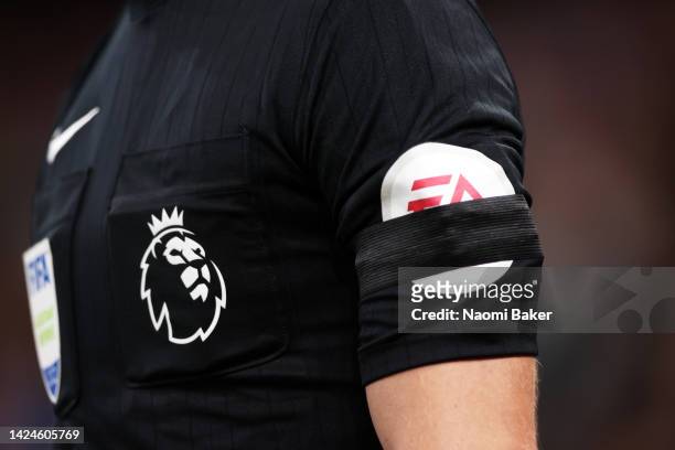 Black armband is seen on the sleeve of a match official as a mark of respect to Her Majesty Queen Elizabeth II who died at Balmoral Castle on...