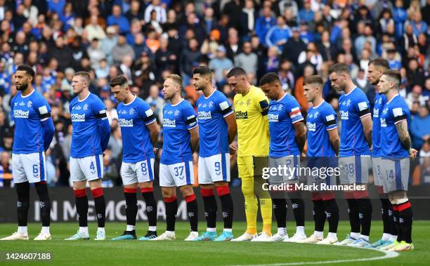 Rangers players observe a minutes silence before kick off to pay tribute to Her Majesty Queen Elizabeth II, who died at Balmoral Castle on September...