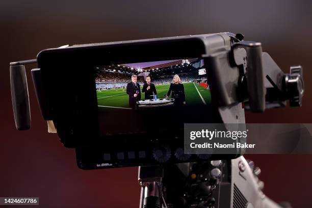 Pundits Jamie Carragher, Gary Neville and Kelly Cates present Friday night football during the Premier League match between Aston Villa and...