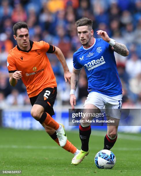 Ryan Kent of Rangers takes on Liam Smith of Dundee United during the Cinch Scottish Premiership match between Rangers FC and Dundee United at on...