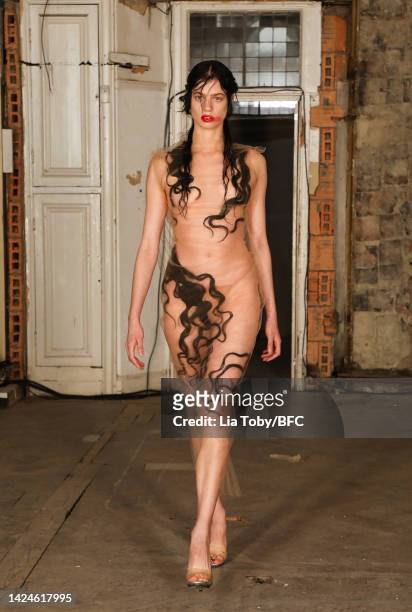 Model walks the runway at the Dilara Findikoglu show during London Fashion Week September 2022 on September 17, 2022 in London, England.