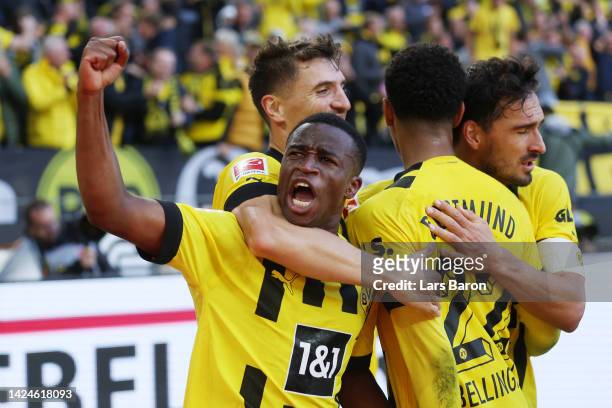 Youssoufa Moukoko of Borussia Dortmund celebrates with teammates after scoring their team's first goal during the Bundesliga match between Borussia...