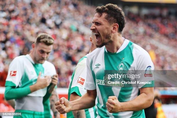 Milos Veljkovic of Werder Bremen celebrates after scoring their team's first goal during the Bundesliga match between Bayer 04 Leverkusen and SV...