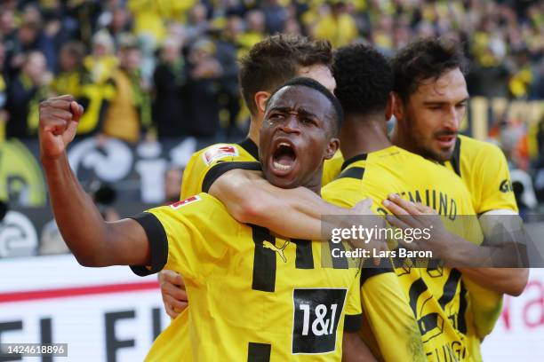 Youssoufa Moukoko of Borussia Dortmund celebrates with teammates after scoring their team's first goal during the Bundesliga match between Borussia...