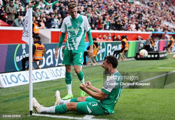 Milos Veljkovic of Werder Bremen celebrates after scoring their team's first goal during the Bundesliga match between Bayer 04 Leverkusen and SV...