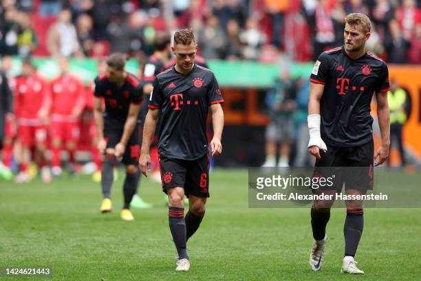 Joshua Kimmich and Matthijs de Ligt of Bayern Munich look dejected following their sides defeat in the Bundesliga match between FC Augsburg and FC...