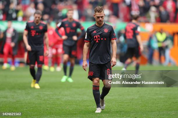 Joshua Kimmich of Bayern Munich looks dejected following their sides defeat in the Bundesliga match between FC Augsburg and FC Bayern München at...