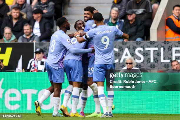 Philip Billing of Bournemouth celebrates with team-mates after he scores a goal to make it 1-0 during the Premier League match between Newcastle...