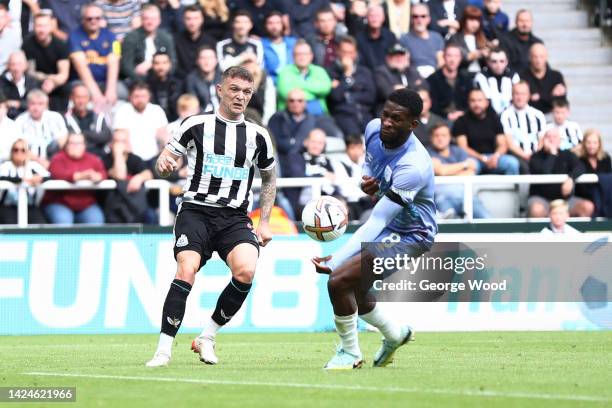 Kieran Trippier of Newcastle United crosses the ball which is adjudged to have hit the hand of Jefferson Lerma of AFC Bournemouth after a VAR check...