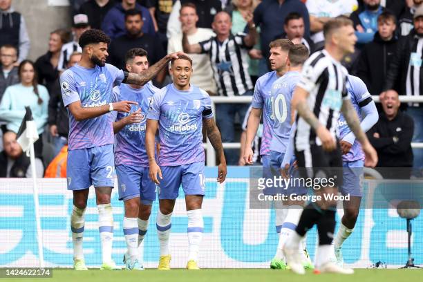 Philip Billing of AFC Bournemouth celebrates after scoring their side's first goal with team mates during the Premier League match between Newcastle...
