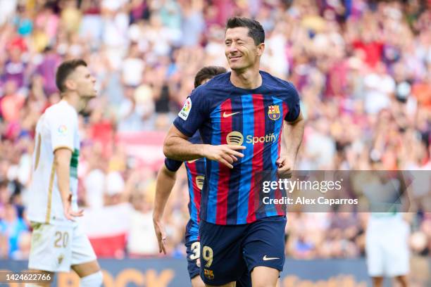 Robert Lewandowski of FC Barcelona celebrates after scoring his team's third goal during the LaLiga Santander match between FC Barcelona and Elche CF...