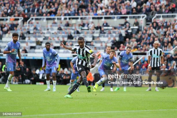 Alexander Isak of Newcastle scores his side's first goal from the penalty spot during the Premier League match between Newcastle United and AFC...
