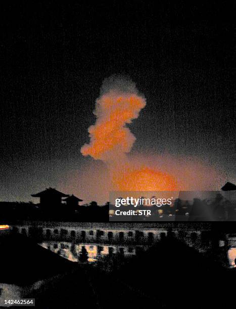 Picture dated 12 October 2002 shows the explosion in a popular nightclub in the tourist district of Kuta in Bali which killed at least 25 people,...