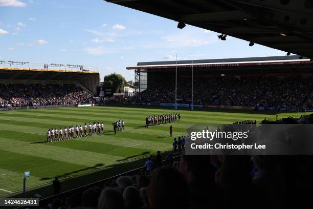 Both teams and fans stand for a minutes silence for Her Majesty Queen Elizabeth II, who passed away at Balmoral Castle on September 8, 2022 prior to...